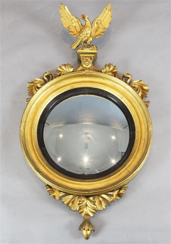 A Regency style giltwood convex wall mirror, W.2ft 1in. H.3ft 10in.